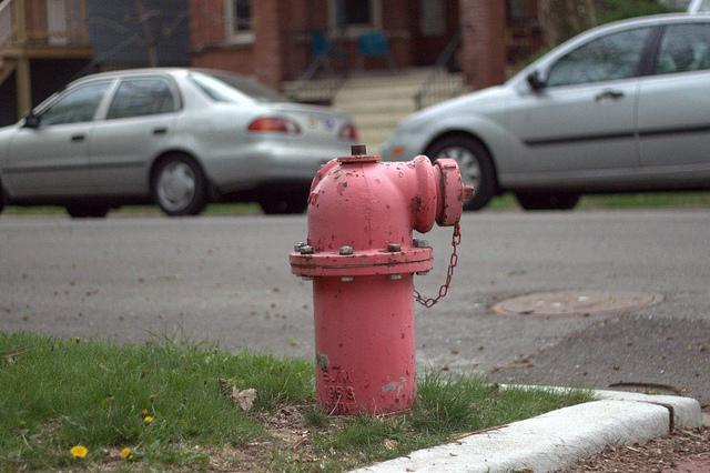 Street scene with cars and fire hydrant